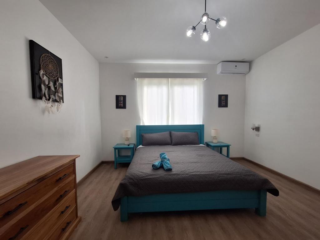 Voodi või voodid majutusasutuse Paunch Beach Retreat toas
