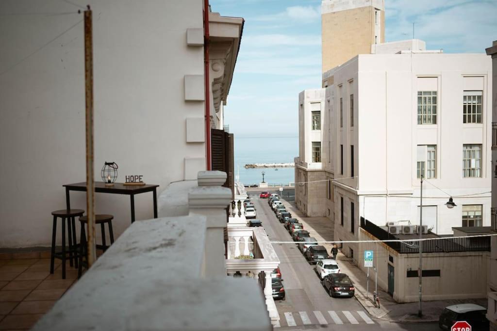 a view of a city street from the balcony of a building at Appartamento centrale vista mare Benny's apartment in Bari