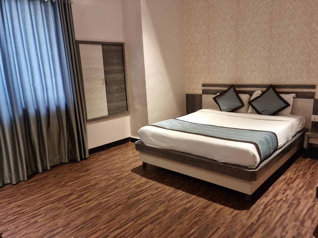 Postel nebo postele na pokoji v ubytování Hotel Kiara Eshosans Palace