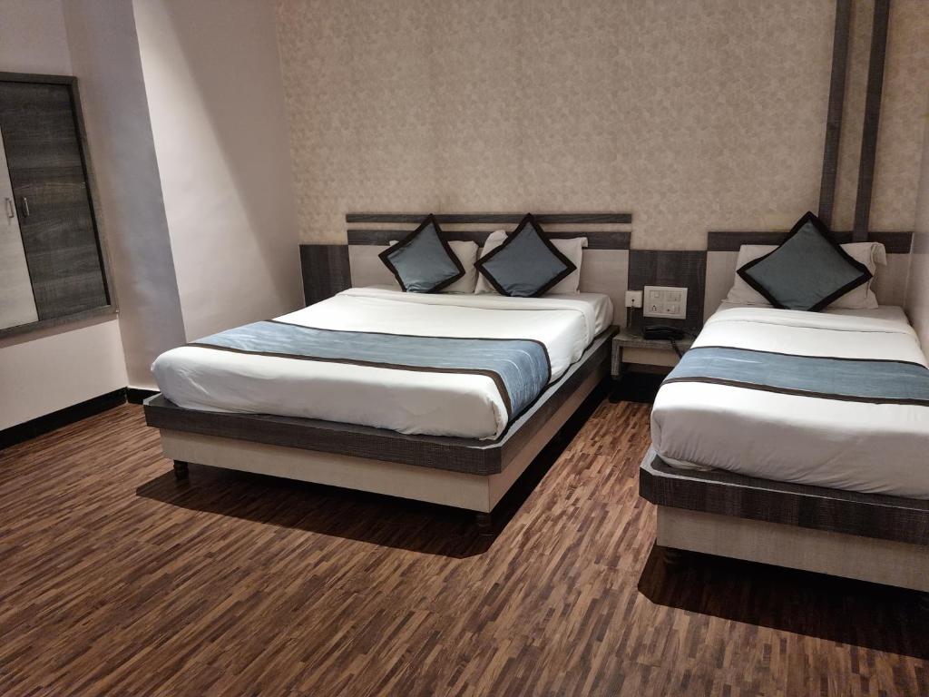 Postel nebo postele na pokoji v ubytování Hotel Kiara Eshosans Palace