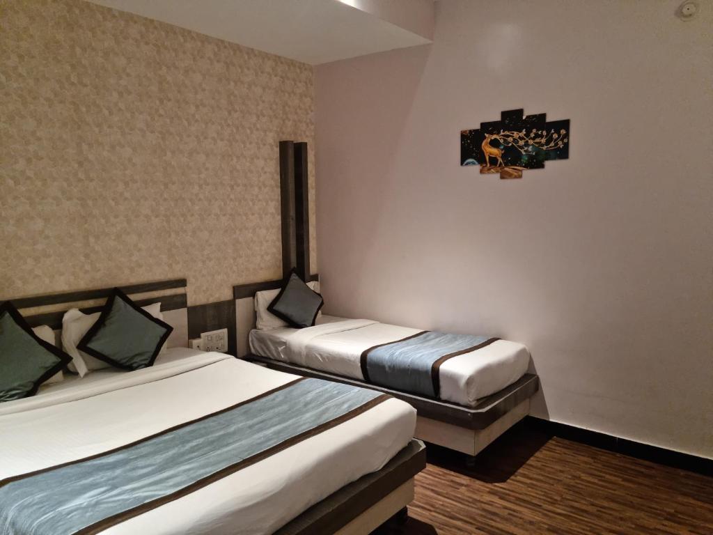 Postel nebo postele na pokoji v ubytování Hotel Kiara Eshosans Palace
