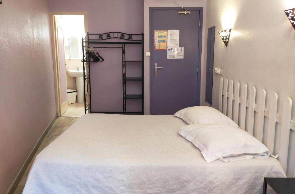 Postel nebo postele na pokoji v ubytování Au Nouvel Hôtel