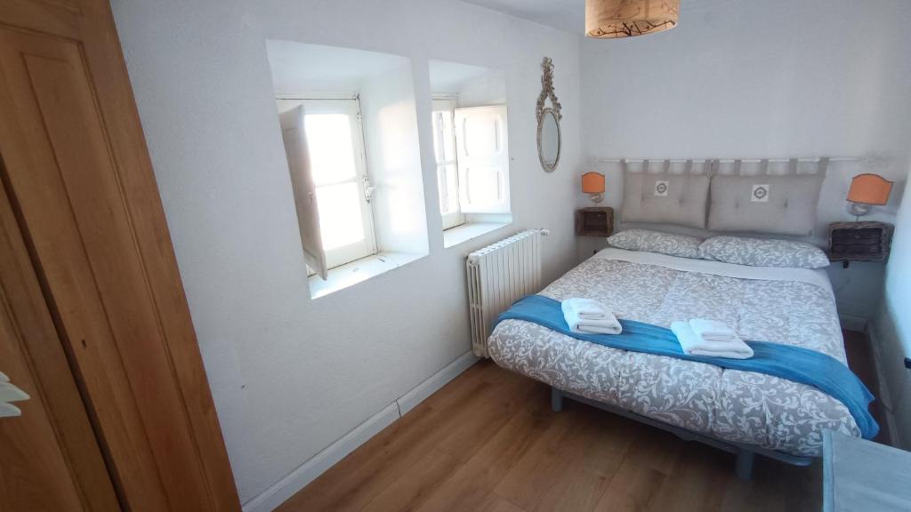 Postel nebo postele na pokoji v ubytování Antico Chalet Momosa Maxi