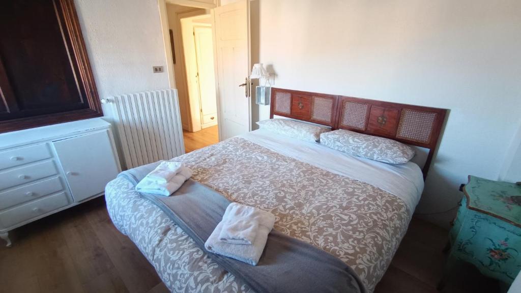 Postel nebo postele na pokoji v ubytování Antico Chalet Momosa Maxi