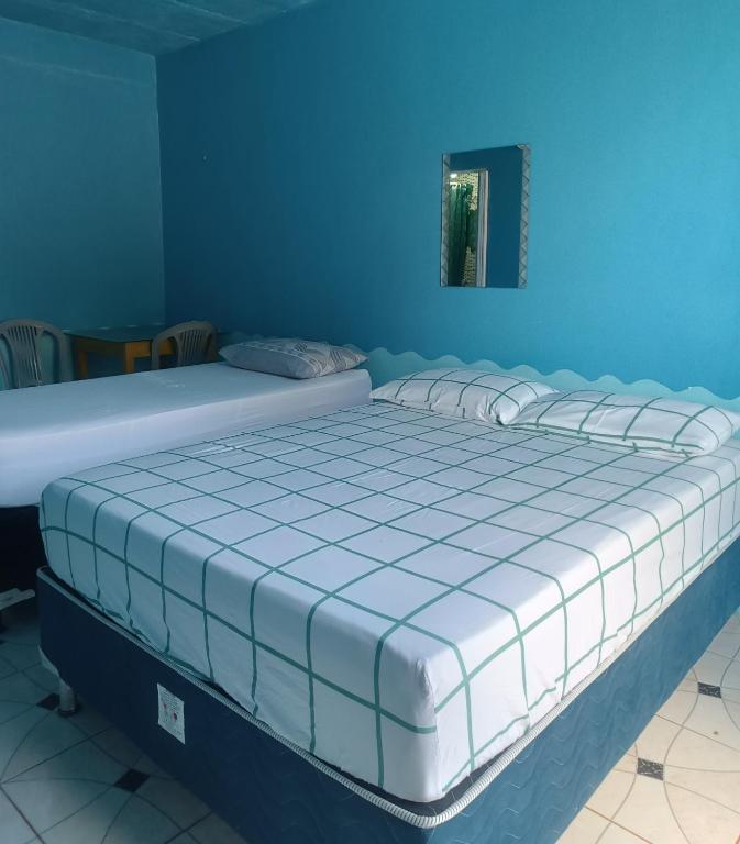 Postel nebo postele na pokoji v ubytování Apartamentos no Farol Velho