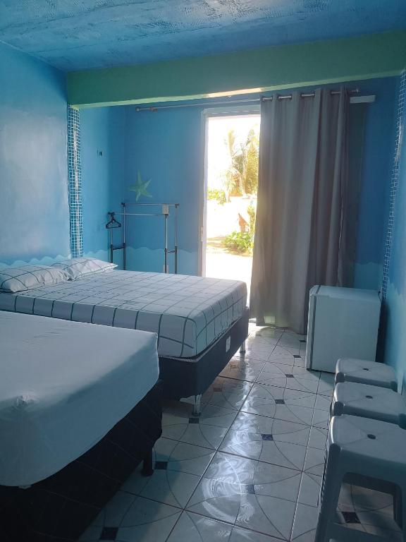 Postel nebo postele na pokoji v ubytování Apartamentos no Farol Velho