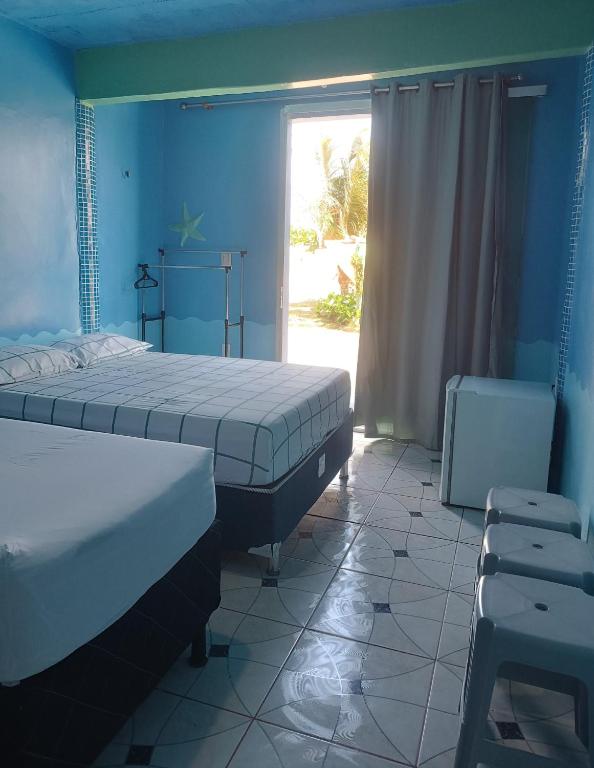 Postel nebo postele na pokoji v ubytování Apartamentos no Farol Velho