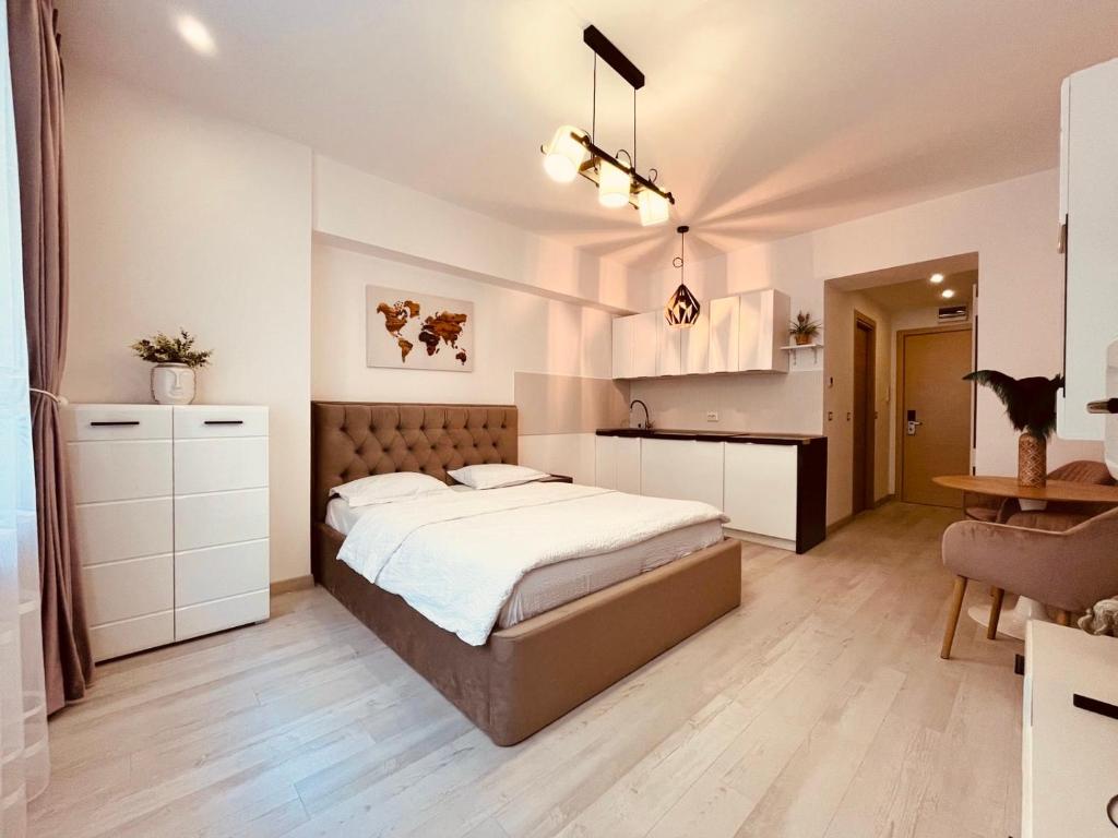 Un pat sau paturi într-o cameră la Sudului ApartHotel