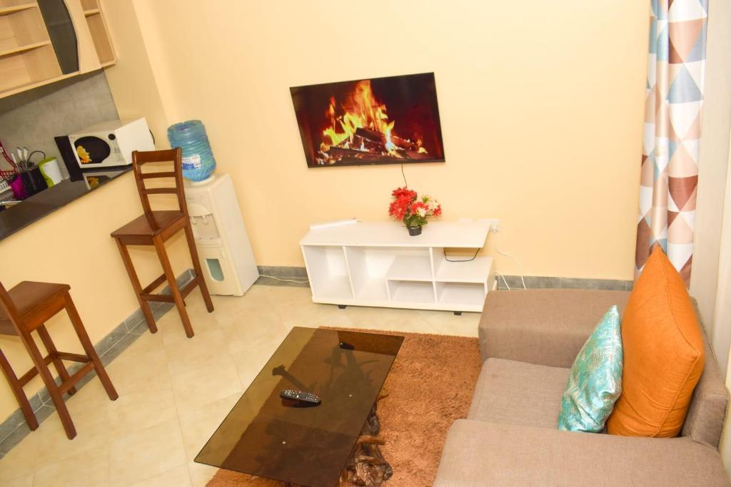 a living room with a couch and a coffee table at Fully furnished two bedroom bnb in Thika town in Thika