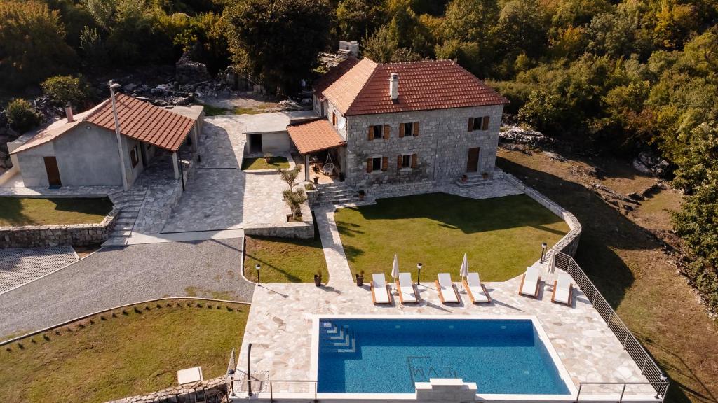 an aerial view of a house with a swimming pool at Etno Villa Mokanji in Danilovgrad