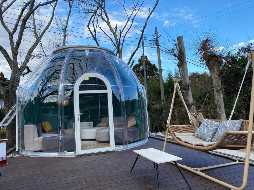 a glass iguana house with a hammock and a swing at Issyuku Ike Issyo En - Vacation STAY 86605v in Tabuchi