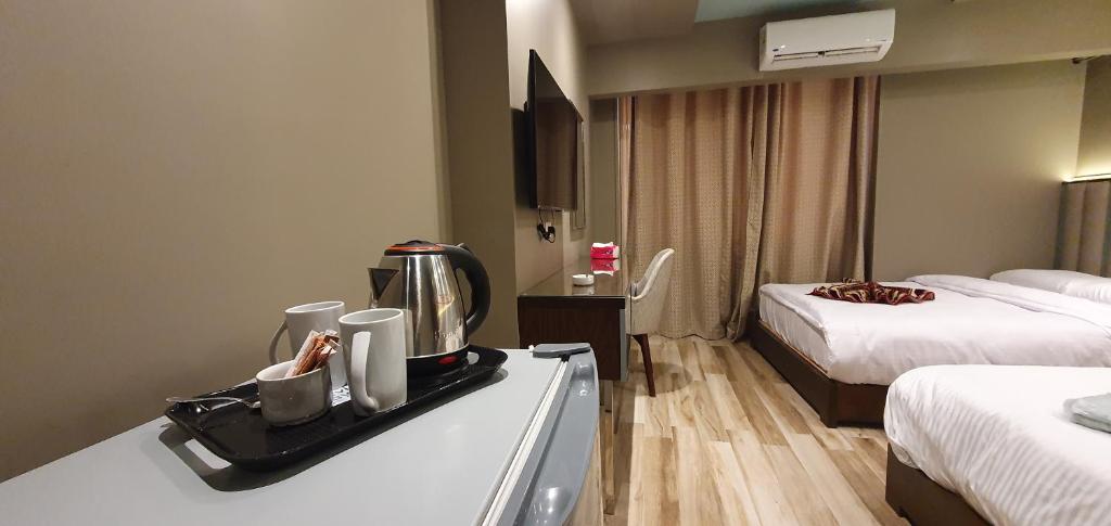 Postel nebo postele na pokoji v ubytování Grand Bayan Hotel & Apt at Nile Plaza