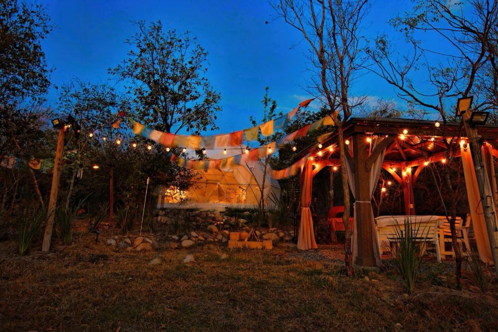 a string of lights on a house at night at CastaVerde in Palomas