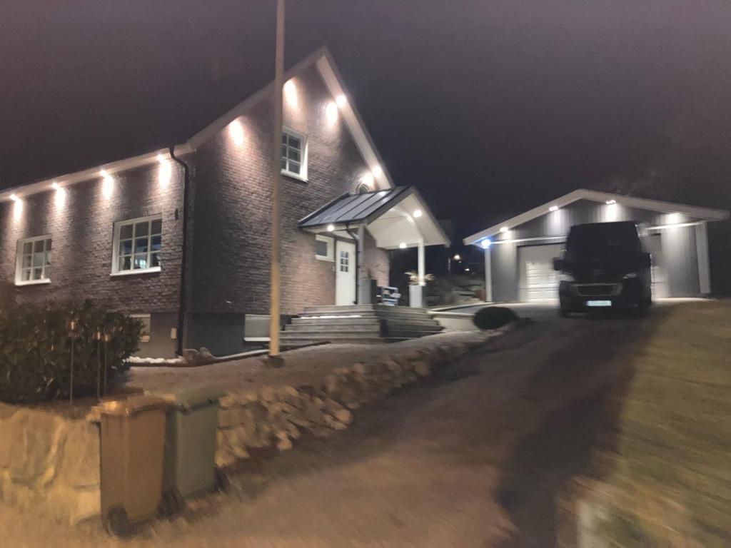 a truck parked in front of a house at night at Villa Amare in Uddevalla