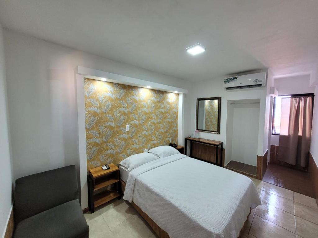 Postel nebo postele na pokoji v ubytování Hotel Costa Inn