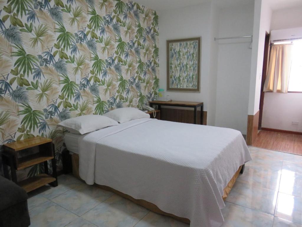 Postel nebo postele na pokoji v ubytování Hotel Costa Inn