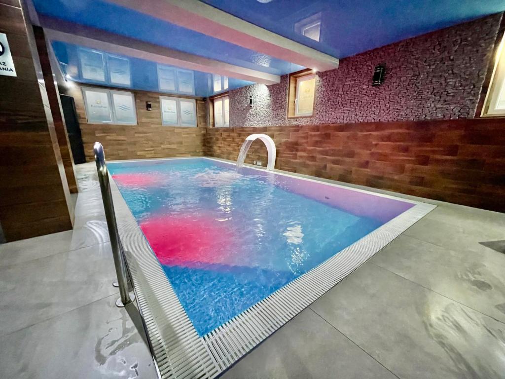 a large swimming pool in a building at Baltic Sun SPA in Rewal