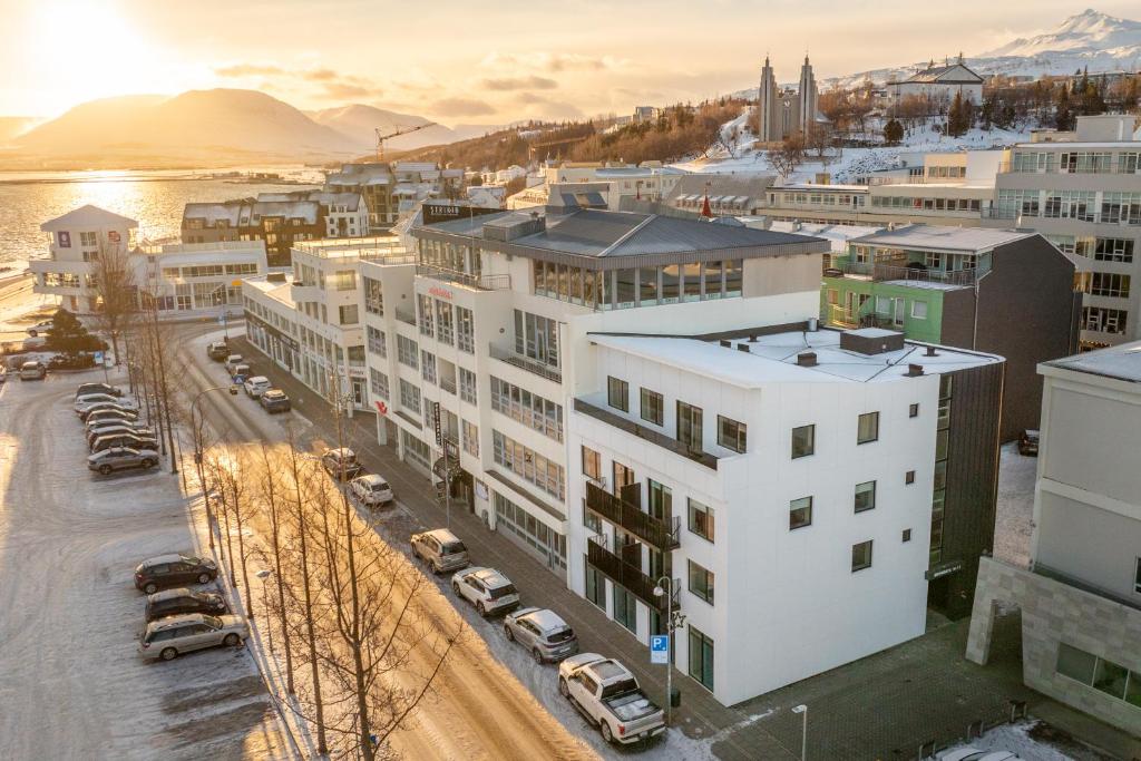 an aerial view of a city with buildings and cars at Luxury stylish apartment central Akureyri in Akureyri