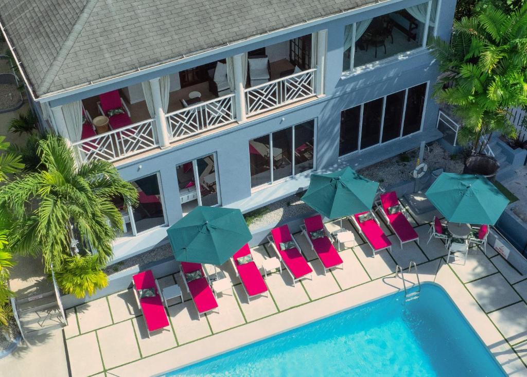 an aerial view of a hotel with chairs and umbrellas at The Palms Resort in Saint James
