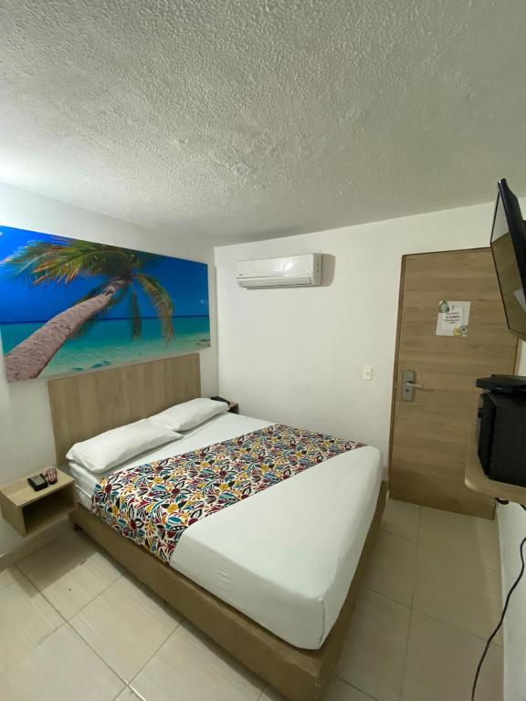 Postel nebo postele na pokoji v ubytování Suites Laureles