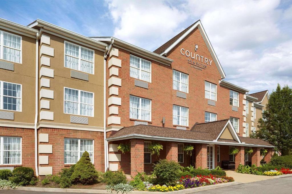 a rendering of a building with a courtyard at Country Inn & Suites by Radisson, Macedonia, OH in Macedonia