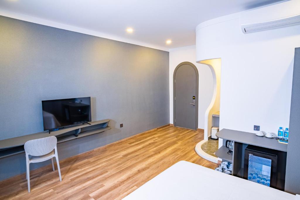 TV a/nebo společenská místnost v ubytování Hafi Boutique Hotel