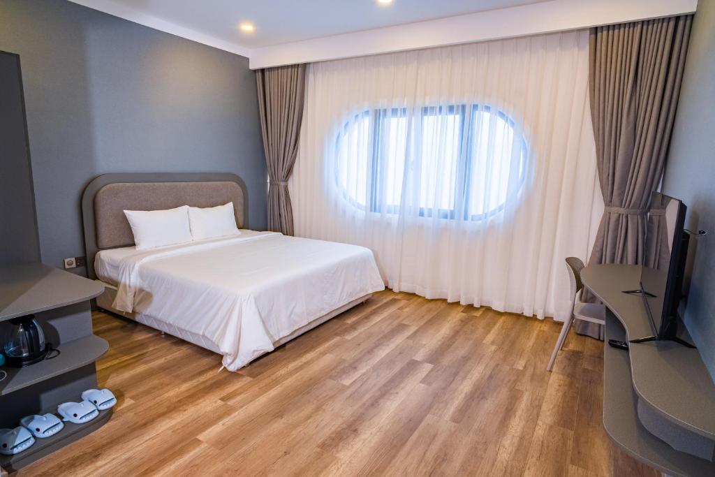 Postel nebo postele na pokoji v ubytování Hafi Boutique Hotel