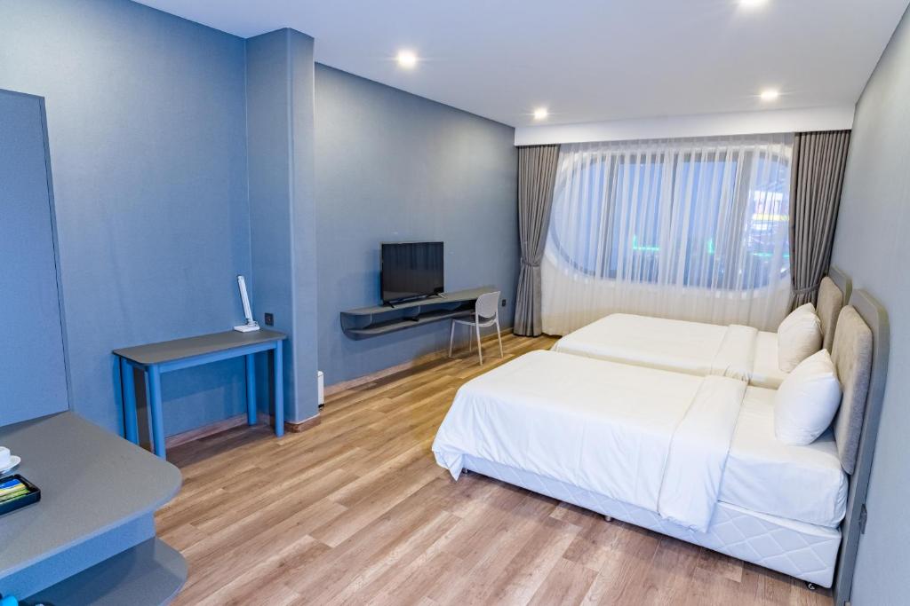 TV a/nebo společenská místnost v ubytování Hafi Boutique Hotel