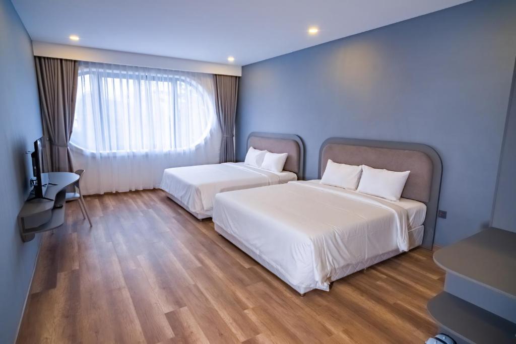 Postel nebo postele na pokoji v ubytování Hafi Boutique Hotel