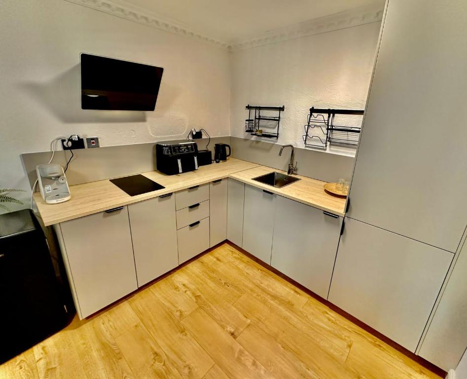 Flat 6 Stay In Aldgate tesisinde mutfak veya mini mutfak