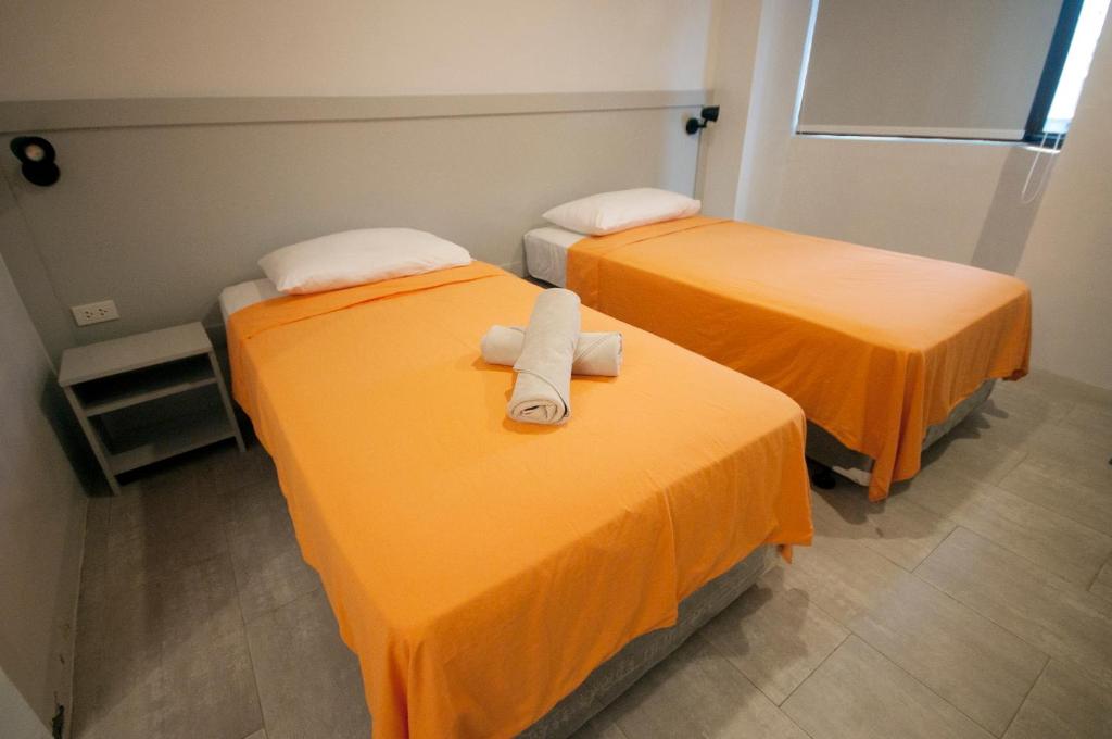 Postel nebo postele na pokoji v ubytování Hotel Lucca