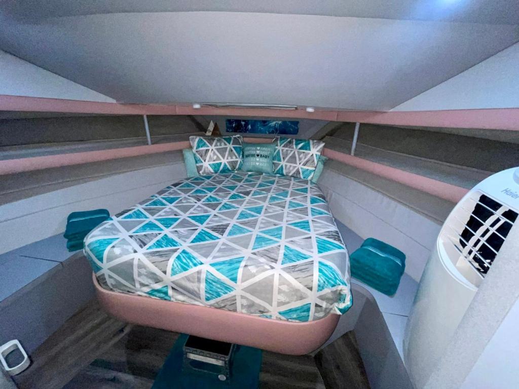 a bed in the back of a boat at Nice Boat in Key Largo in Key Largo