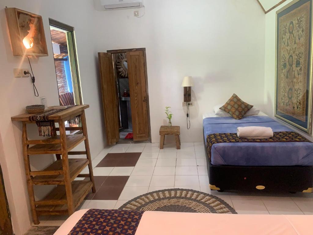 Postel nebo postele na pokoji v ubytování Nextdoor Rooms