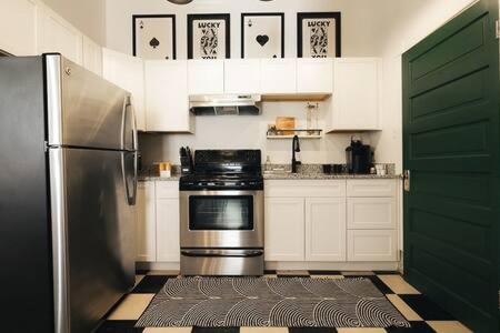 a kitchen with a stove and a refrigerator at Knox Vegas in Knoxville