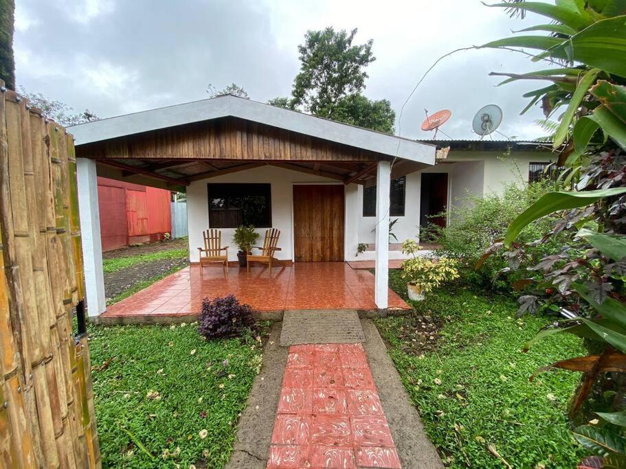 a small house with a porch and a patio at Hijos del Bosque in Bijagua