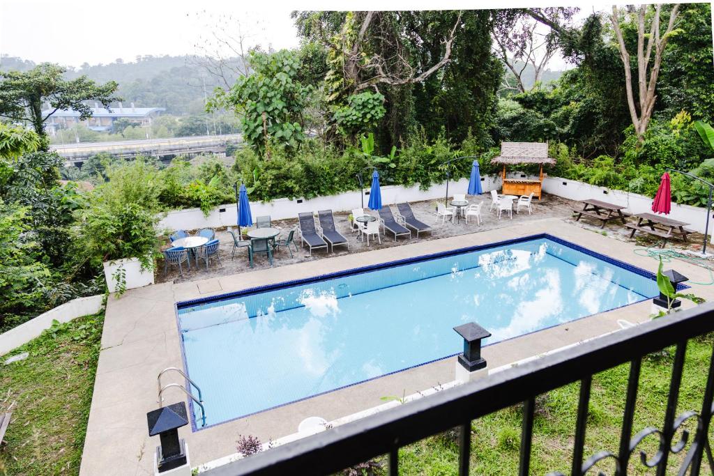 a swimming pool on the balcony of a house at Bangsar Villa for groups, event space and family fun in Kuala Lumpur