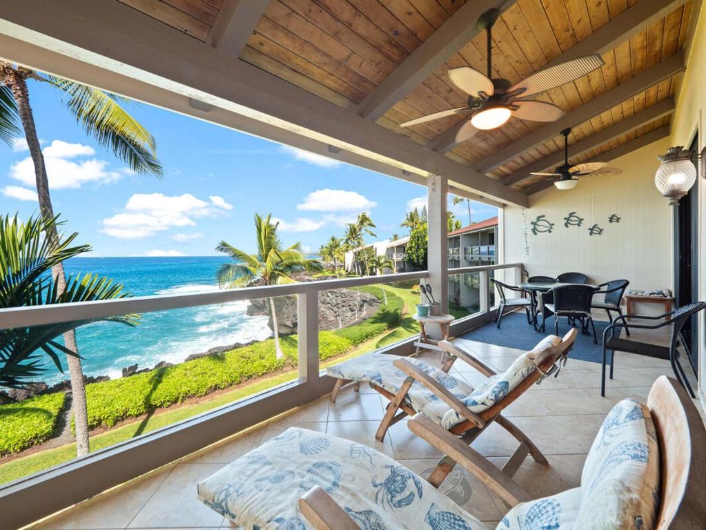 a living room with a view of the ocean at Keauhou sea cliff oceanfront hale in Kailua-Kona