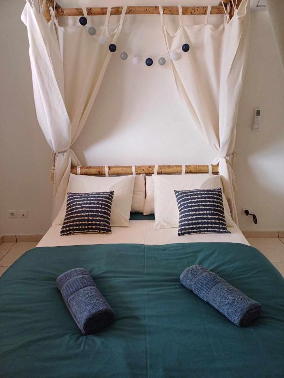 Postel nebo postele na pokoji v ubytování Ô Licuala Villa