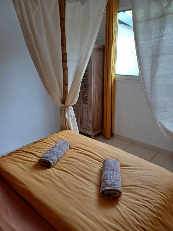 Postel nebo postele na pokoji v ubytování Ô Licuala Villa