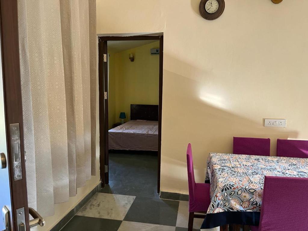 Postel nebo postele na pokoji v ubytování Vijushbhuvi