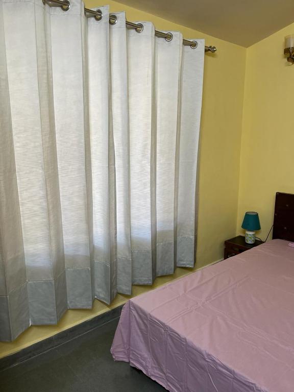 Postel nebo postele na pokoji v ubytování Vijushbhuvi