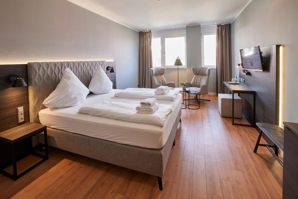 Postel nebo postele na pokoji v ubytování Hotel Soho