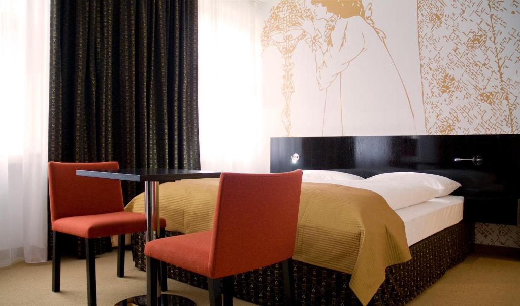 Postel nebo postele na pokoji v ubytování Alma Boutique-Hotel