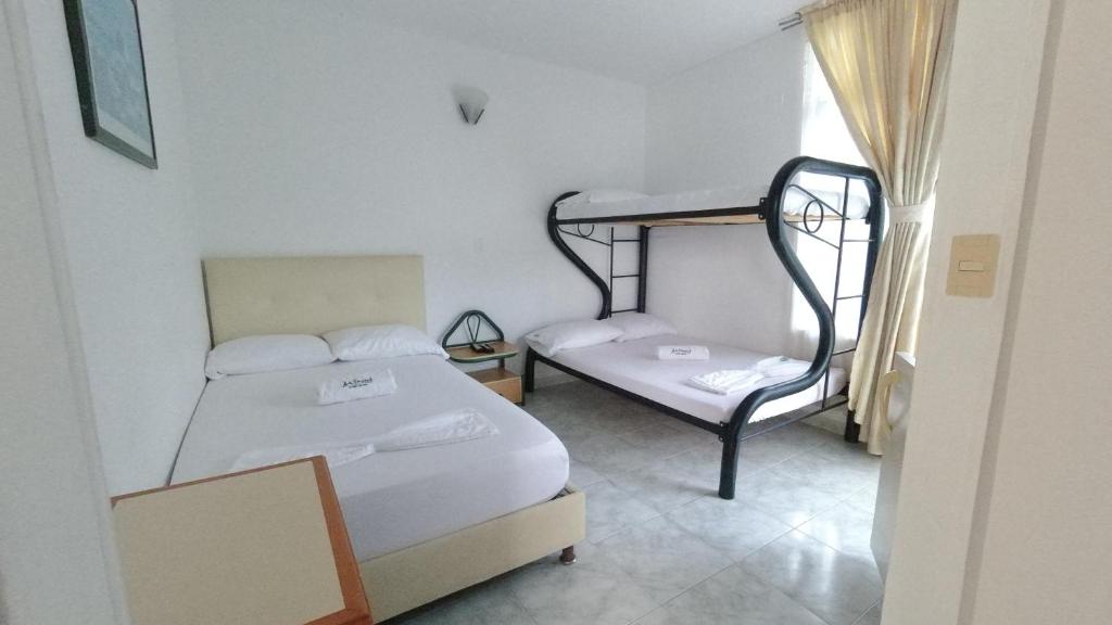 Postel nebo postele na pokoji v ubytování Hotel Miami en Melgar