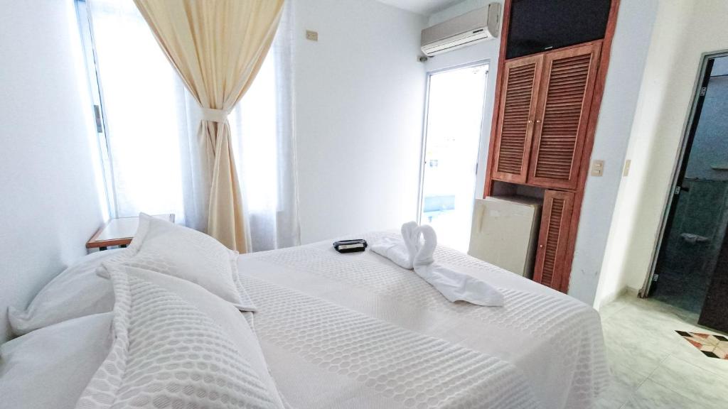 Postel nebo postele na pokoji v ubytování Hotel Miami en Melgar