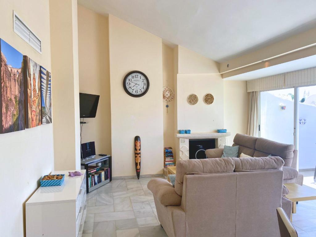 A seating area at Benalmadena Harbour Penthouse with big terrace and sea view
