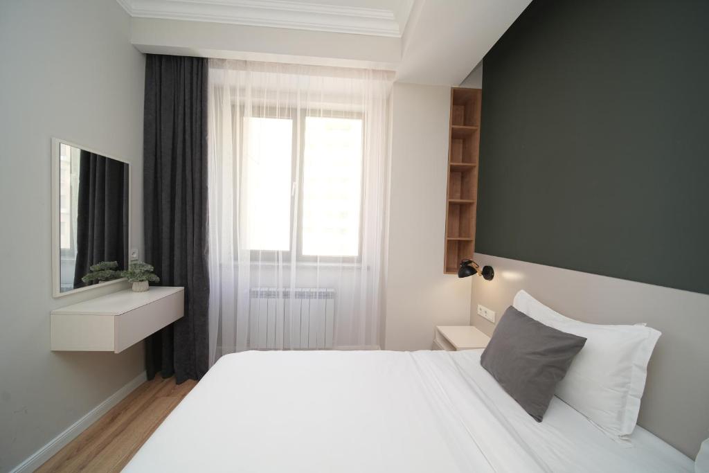 Postel nebo postele na pokoji v ubytování Sweet Home Apart-Hotel