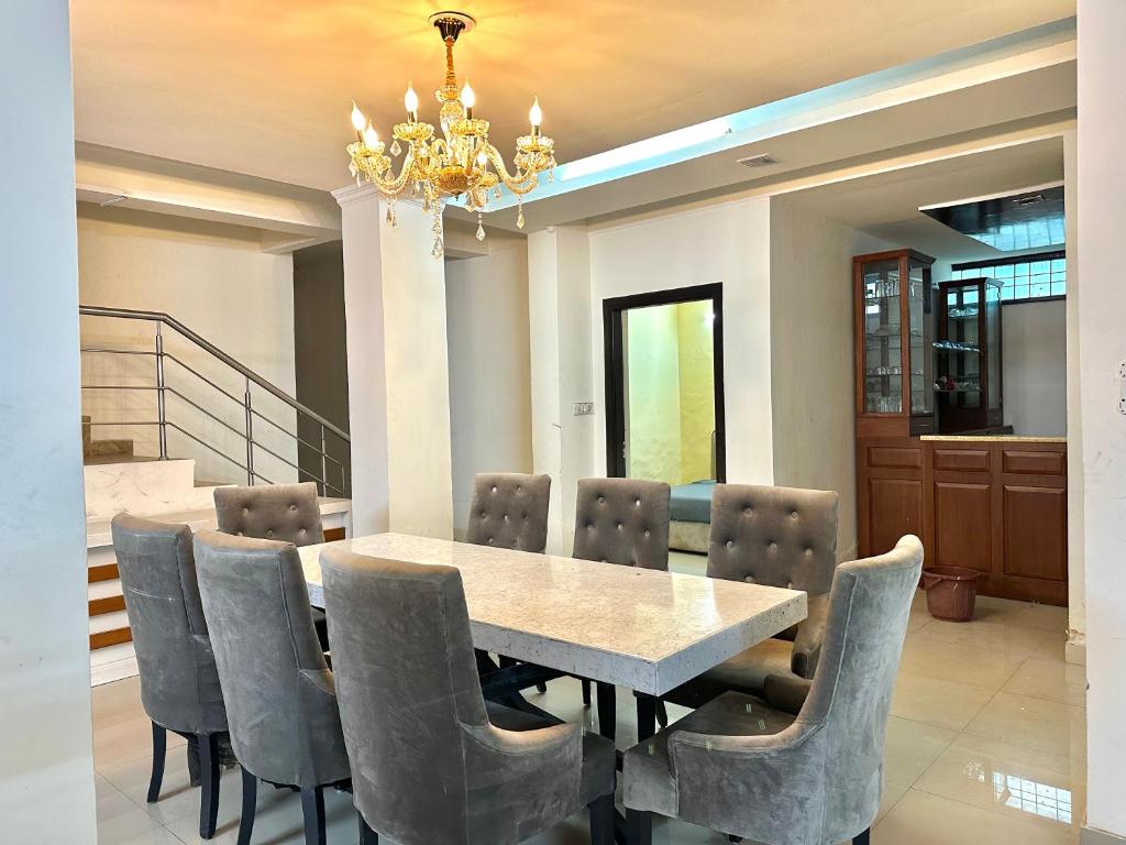 a dining room with a table and chairs at entire house 17 rooms best for marriage/gatherings functions in Gurgaon
