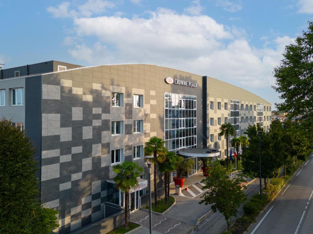 a building with a cube pattern on the side of it at Crowne Plaza Venice East, an IHG Hotel in Quarto dʼAltino