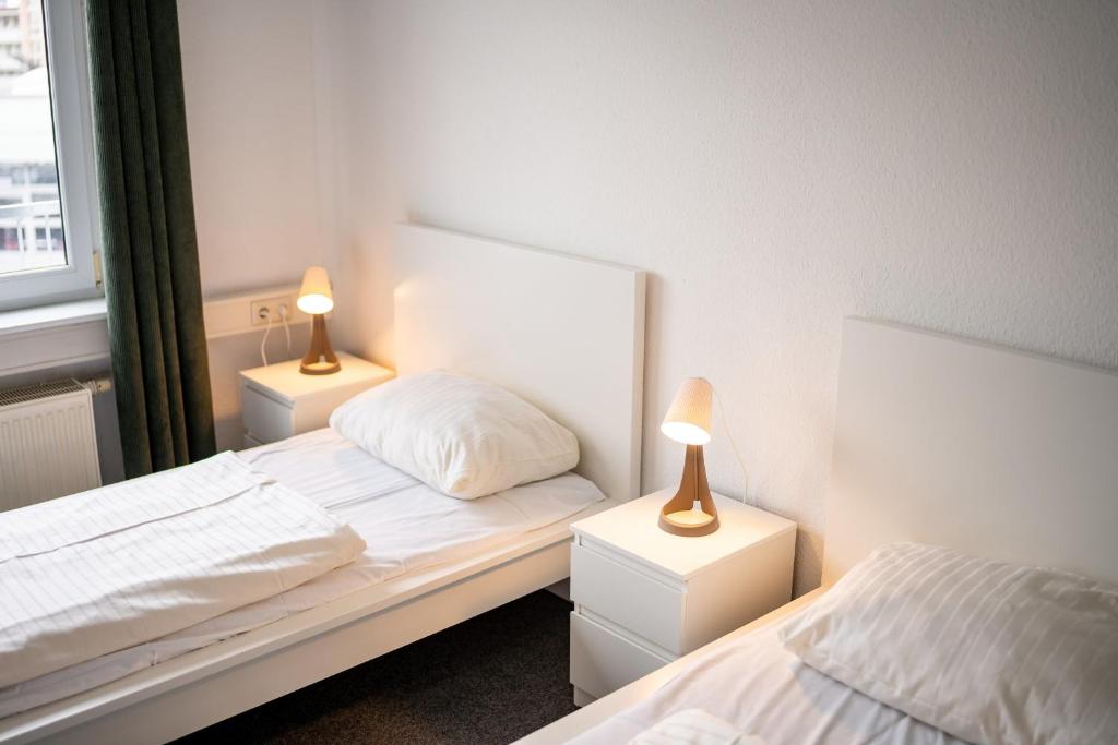 Tempat tidur dalam kamar di ATRIUM - komfortables Apartment HORCHHEIMER